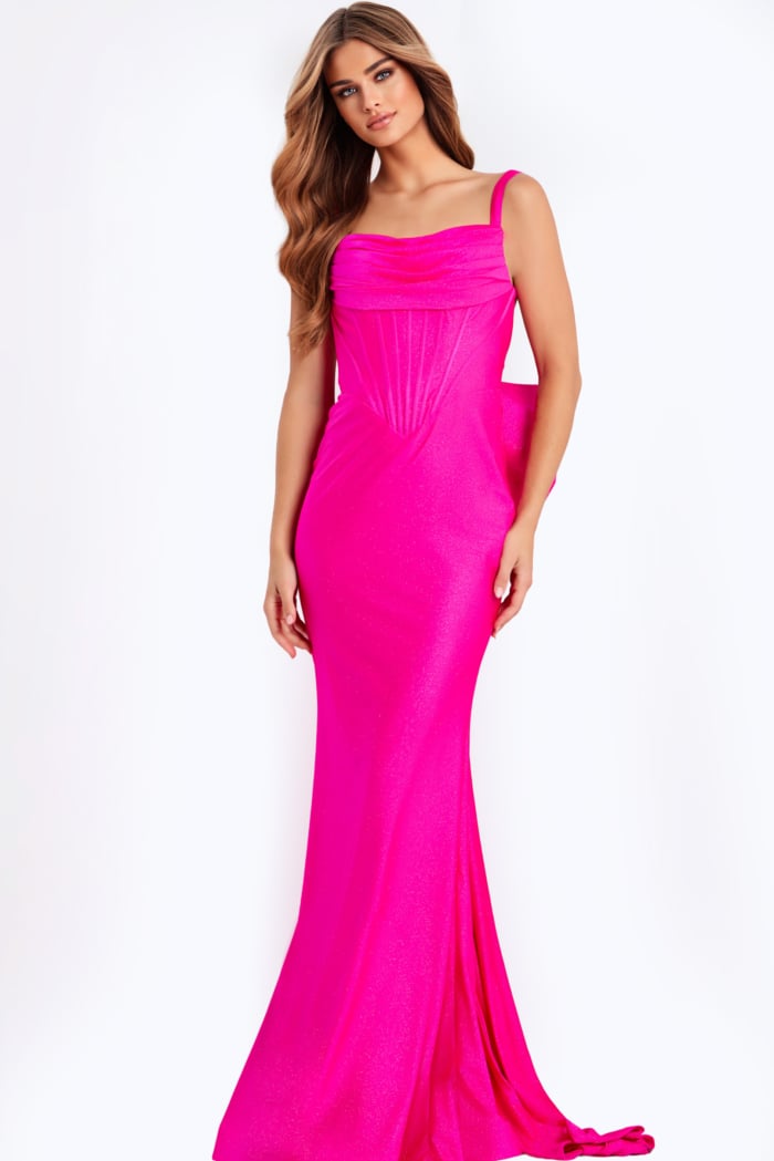 Pink fitted prom dress with draped bodice and large bow back detail