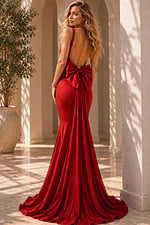 Shimmering red dress in arched corridor