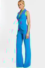 Side angle of blue fitted sleeveless jumpsuit with notched lapel