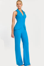 Three-quarter front view of structured sleeveless blue jumpsuit