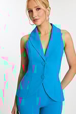 Close-up of blue sleeveless jumpsuit showing lapel and button details