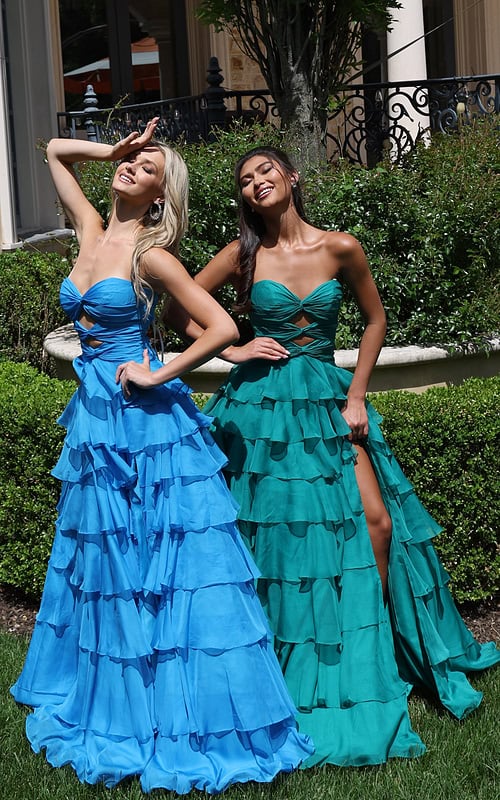 ruffled strapless tiered prom dress - two girls front, blonde hand shielding eyes, brunette showing leg
