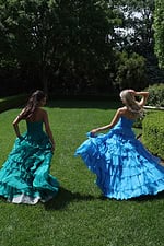 ruffled strapless tiered prom dress - group back view, girls walking away, looking back