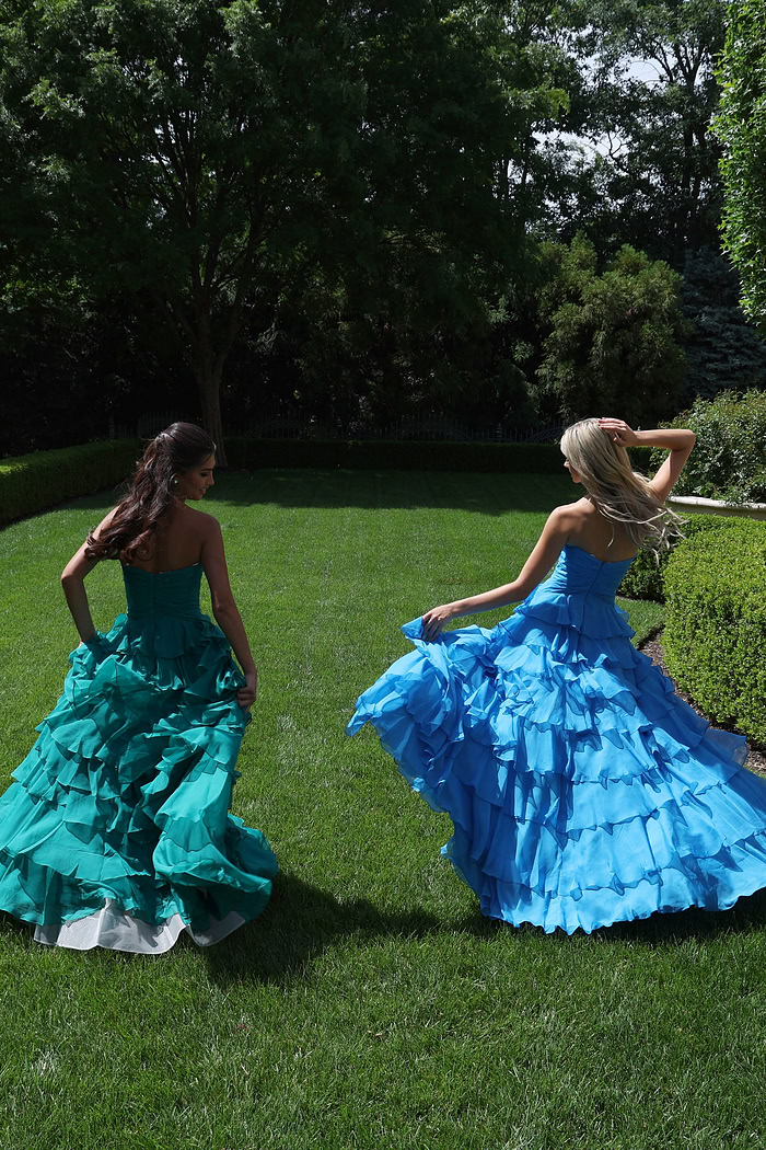ruffled strapless tiered prom dress - group back view, girls walking away, looking back