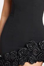 Close-up of black satin roses on dress hemline