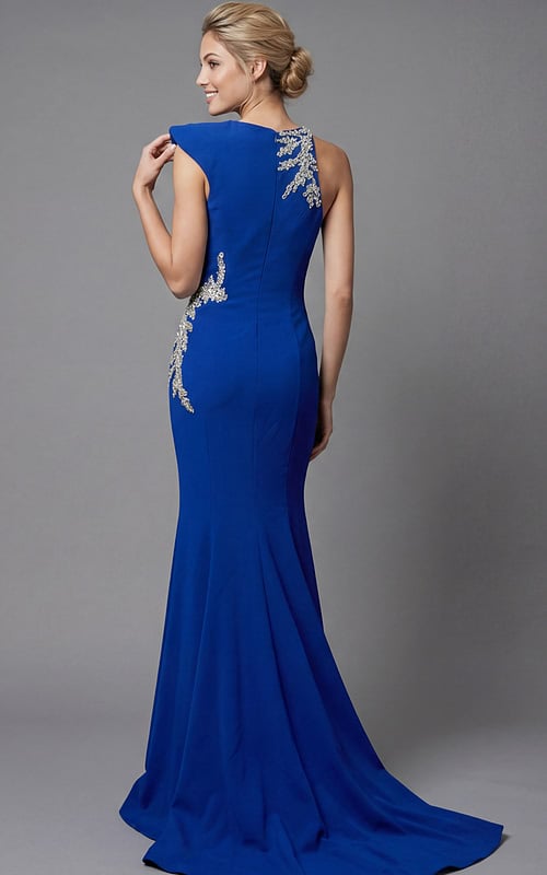 Back view of a sleek one shoulder gown with smooth silhouette and detailed crystal accents