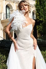 Statement white gown with textured flower accent and shimmering fabric