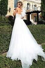 Elegant long gown with slit and sheer layered train