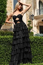 black hot pink strapless twist bodice ruffled maxi dress - front full body, hand on forehead, outdoor setting