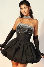 Black strapless mini cocktail dress with crystal embellished bodice and bubble skirt hem, styled with sheer black gloves and matching choker necklace
