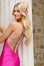 Hot pink halter prom dress with crystal beaded neckline and fitted silhouette
