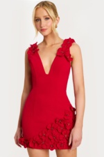 Elegant black cocktail dress with sculpted roses along hemline