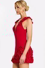 Side profile of black cocktail dress with rose embellishments