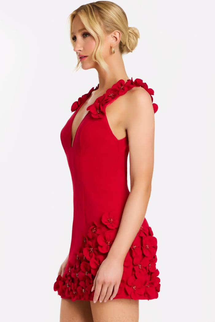 Side profile of black cocktail dress with rose embellishments