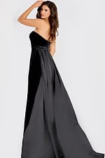 Strapless gown featuring a velvet bodice with a flowing satin overskirt and long train, creating an elegant and timeless evening look.