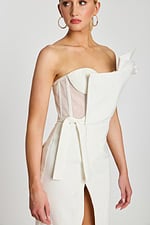 One-shoulder ivory midi dress with sculpted neckline, high slit, and fitted waist