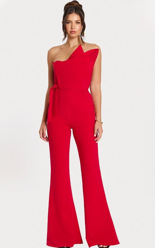 Front view of red one-shoulder structured jumpsuit with flared legs
