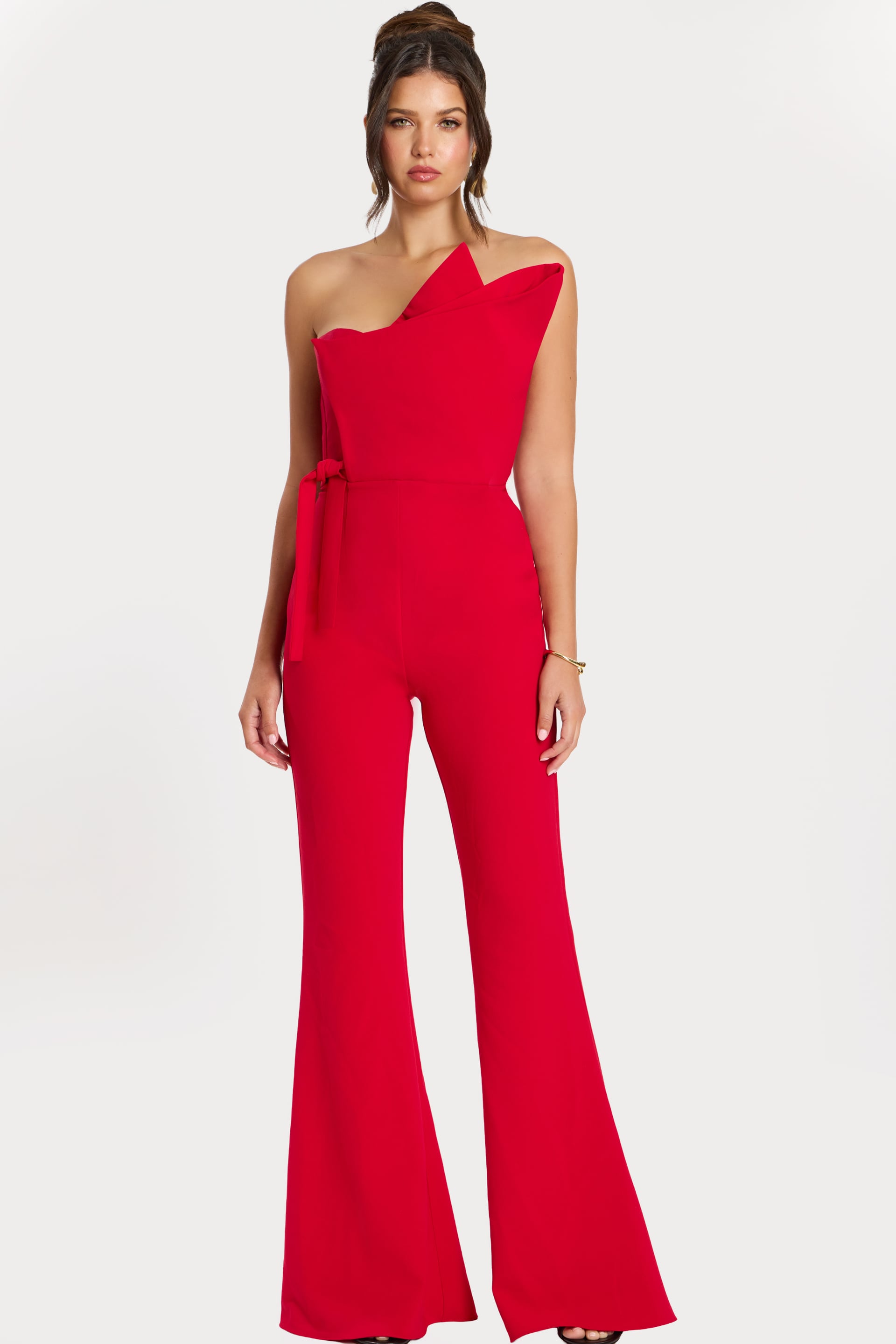 48206_RED_1 Front view of red one-shoulder structured jumpsuit with flared legs