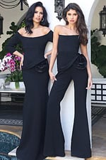 Jovani 48207 black off the shoulder three quarter sleeve fitted gown and Jovani 48209 black strapless flare leg jumpsuit, both featuring rosette flower detail at the waist with peplum accent