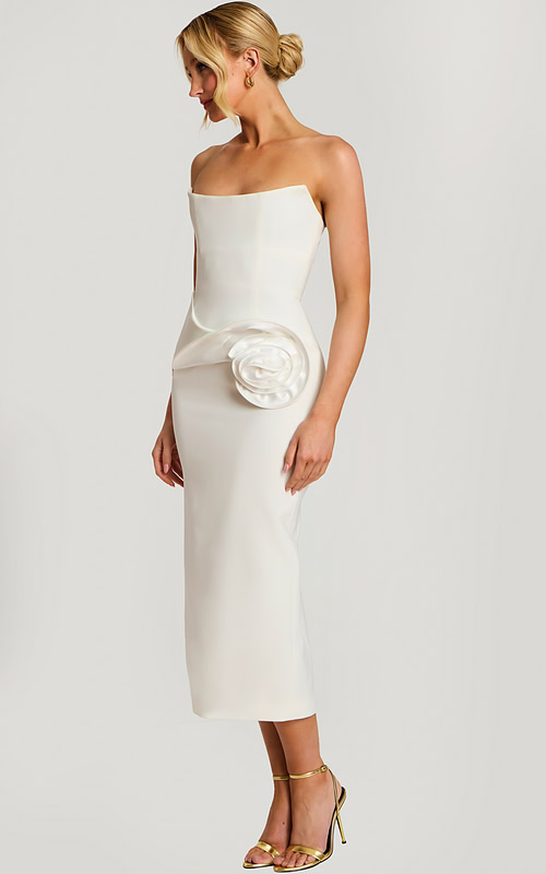 Strapless off-white midi dress with structured bodice and large satin rose detail at the hip