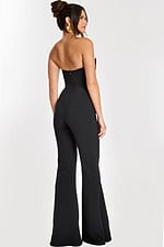 Back view of sleek strapless black flared-leg jumpsuit