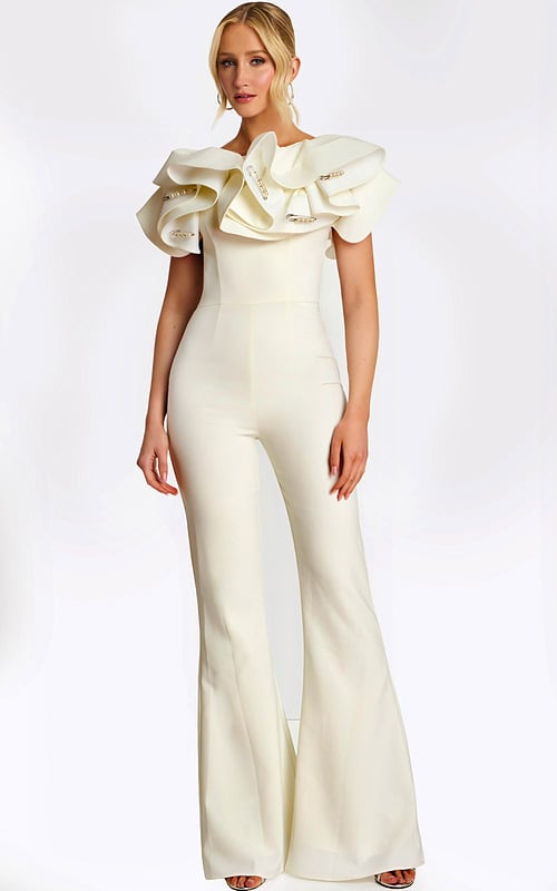 Elegant white jumpsuit with dramatic ruffled shoulders and pearl safety pin accents