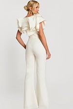 Angled back view of structured white jumpsuit with flared pants