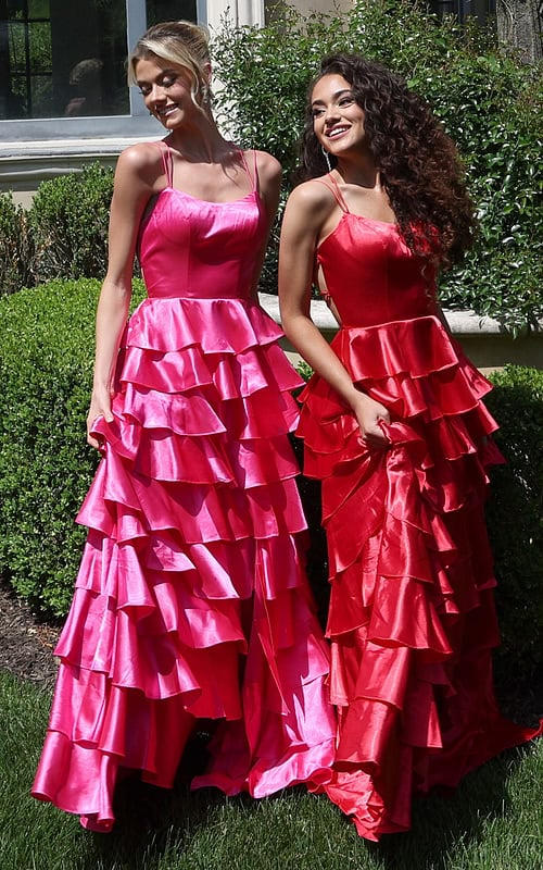 tiered satin dress with spaghetti straps - two girls front, blonde updo curly hair smiling