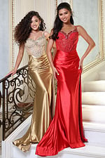 beaded corset satin prom dress with high slit - two girls front, curly hair railing staircase smiling