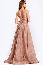 Nude tulle prom gown with shimmering beaded embellishments