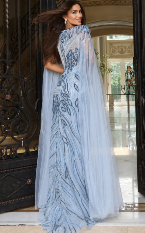 Powder blue sequin gown with sheer cape sleeves and swirl embellishment pattern, side view