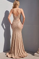 Champagne sequin prom gown with side cutout, wrap bodice, spaghetti straps, high leg slit, and floor-length silhouette.