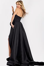 Flowing black evening dress with dramatic train and side slit