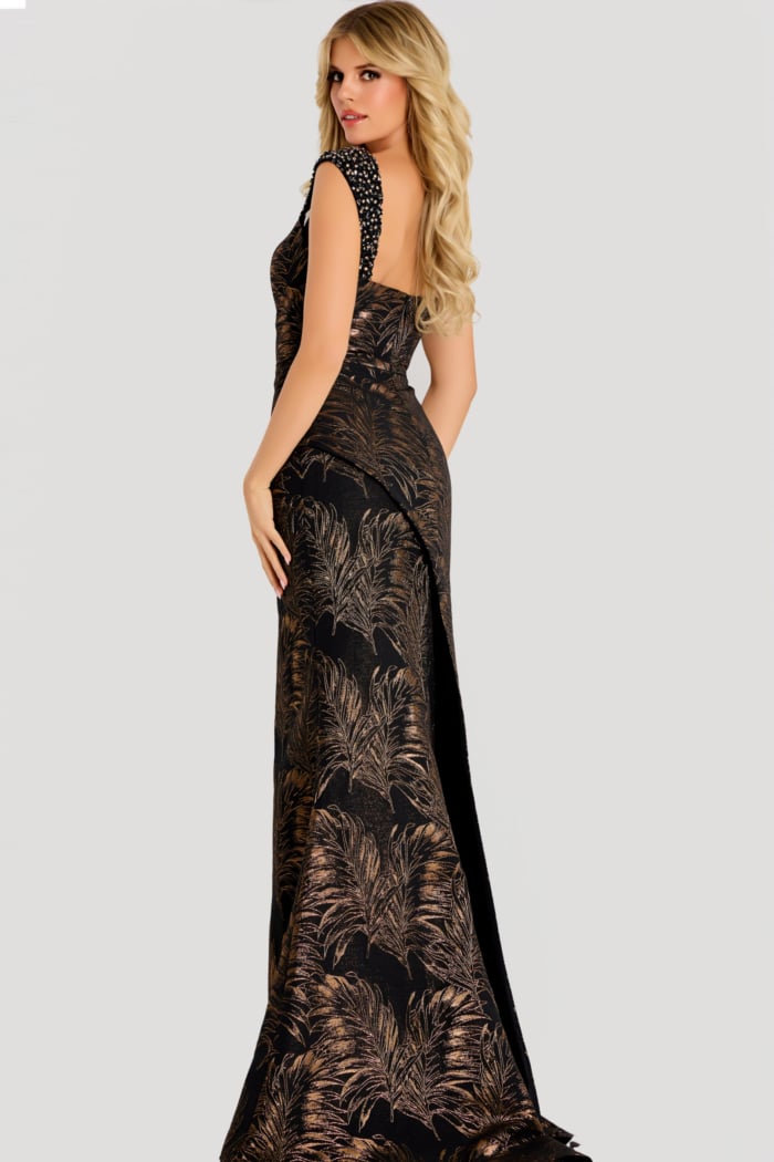 Metallic jacquard gown with beaded shoulder straps, fitted silhouette, and elegant leaf-patterned shimmer fabric.