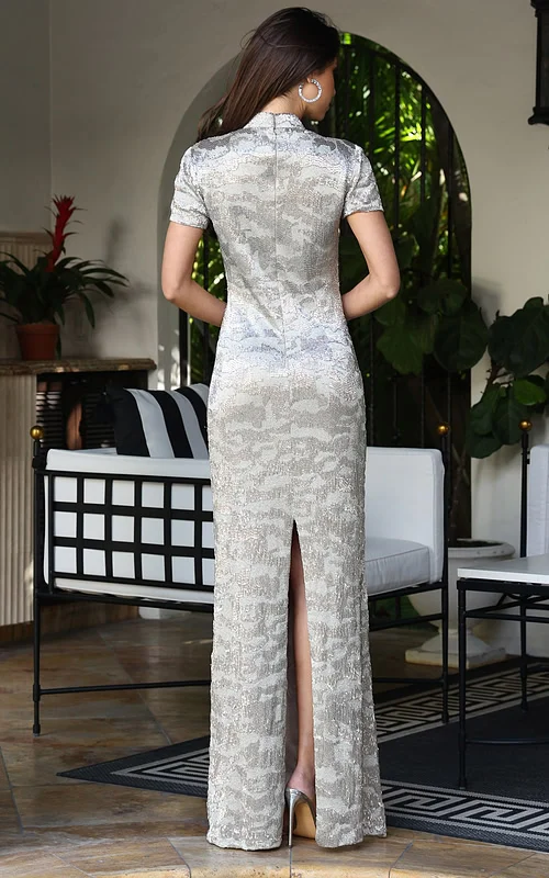 Jovani 48595 nude silver sequin fitted column gown back view with short sleeves, high collar neckline, zipper closure, and back slit