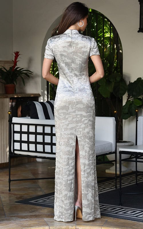 Jovani 48595 nude silver sequin fitted column gown back view with short sleeves, high collar neckline, zipper closure, and back slit