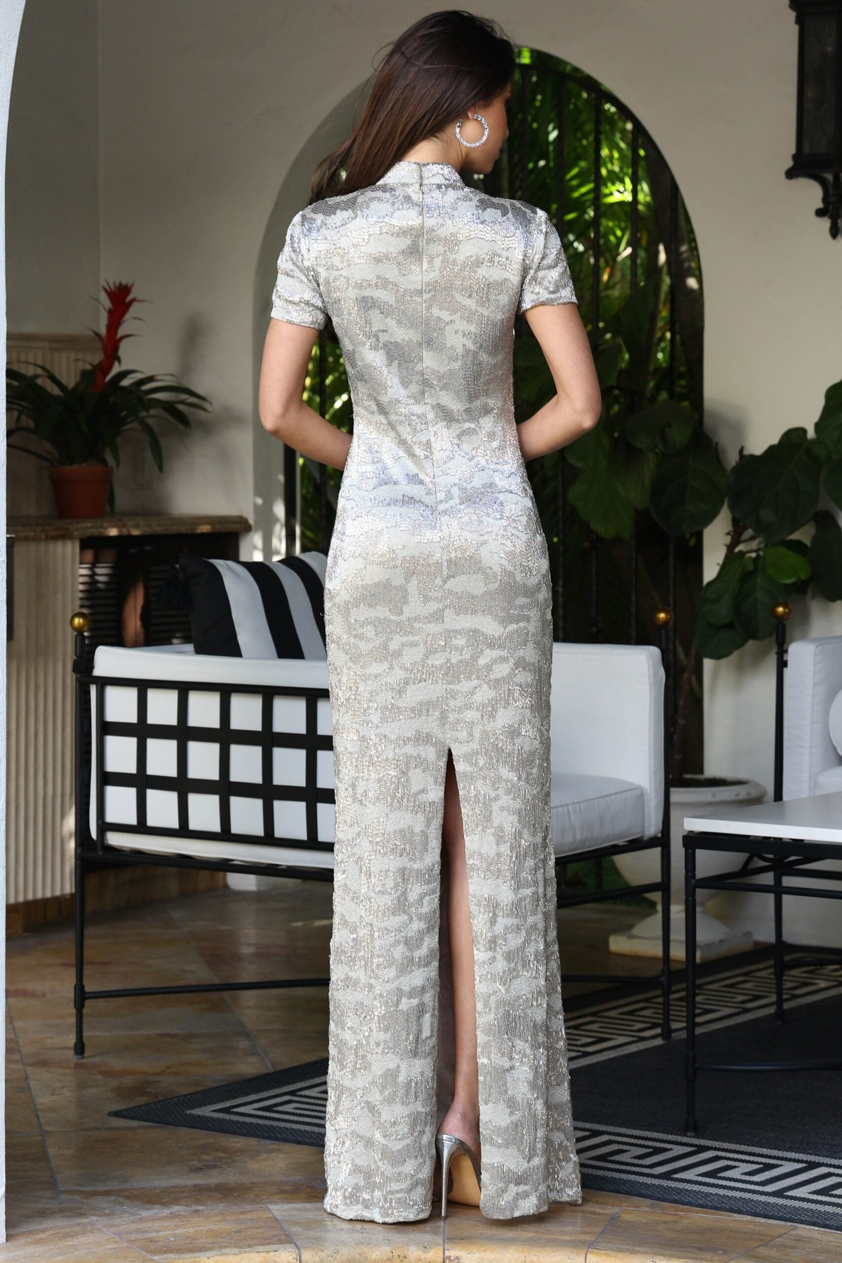 Jovani 48595 nude silver sequin fitted column gown back view with short sleeves, high collar neckline, zipper closure, and back slit