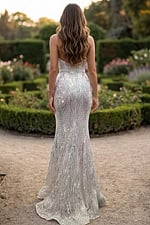 Back view of strapless mermaid gown with crystal beading and long sweep train