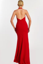 Back view of low-cut halter red gown with zipper detail