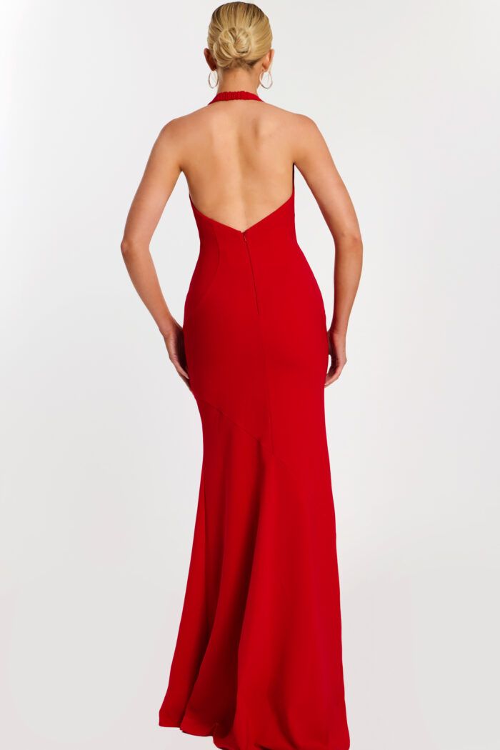 Back view of low-cut halter red gown with zipper detail
