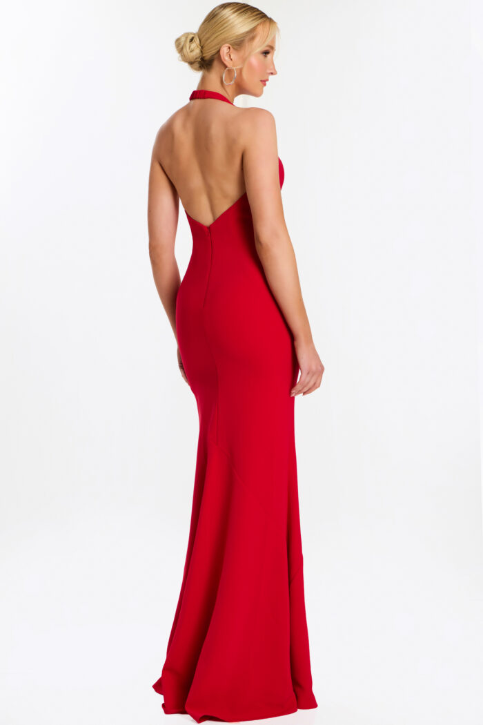 Rear side angle of red halter gown with soft train and fitted waist