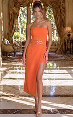 Bold orange asymmetrical party dress with a straight-across neckline and a tiered high-low silhouette.