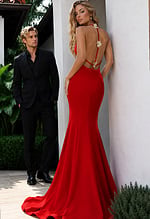 formal gown with one-shoulder floral appliqué and curve-hugging mermaid design.