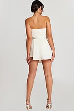 Back view of the strapless ivory romper with fitted waist