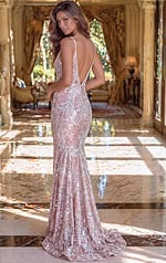 Back view of a blush pink sequin gown showing a low-cut V-back and a graceful floor-length train.