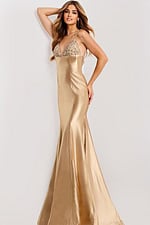 Sleek backless gold gown with spaghetti straps