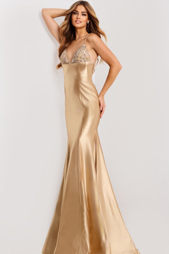 Sleek backless gold gown with spaghetti straps