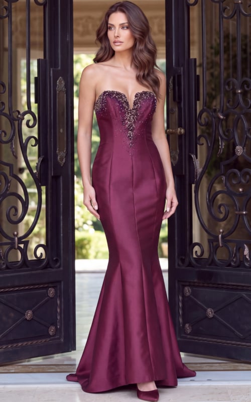 Deep plunge illusion panel and crystals on a strapless red satin fishtail gown