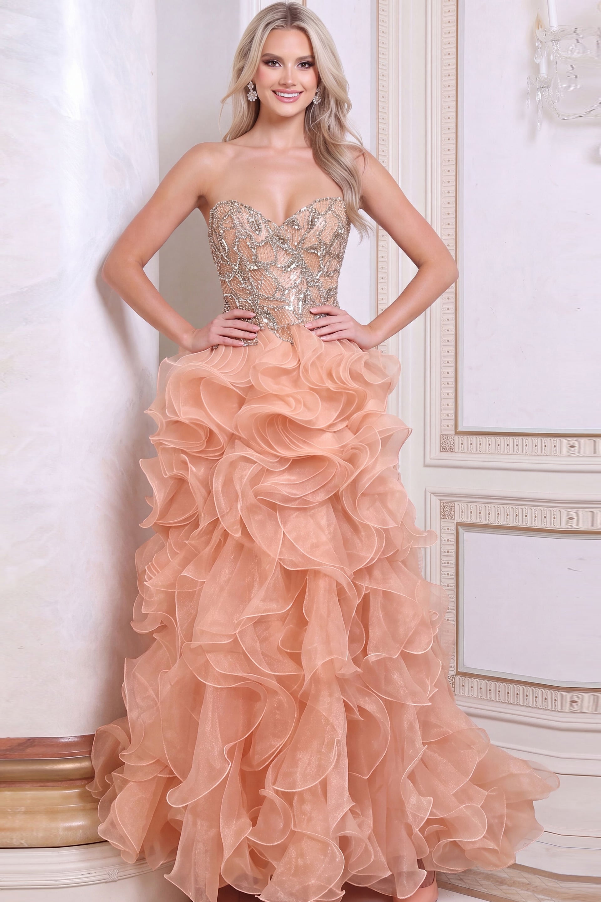 Blush peach strapless evening gown with crystal beaded corset bodice and cascading organza ruffle skirt