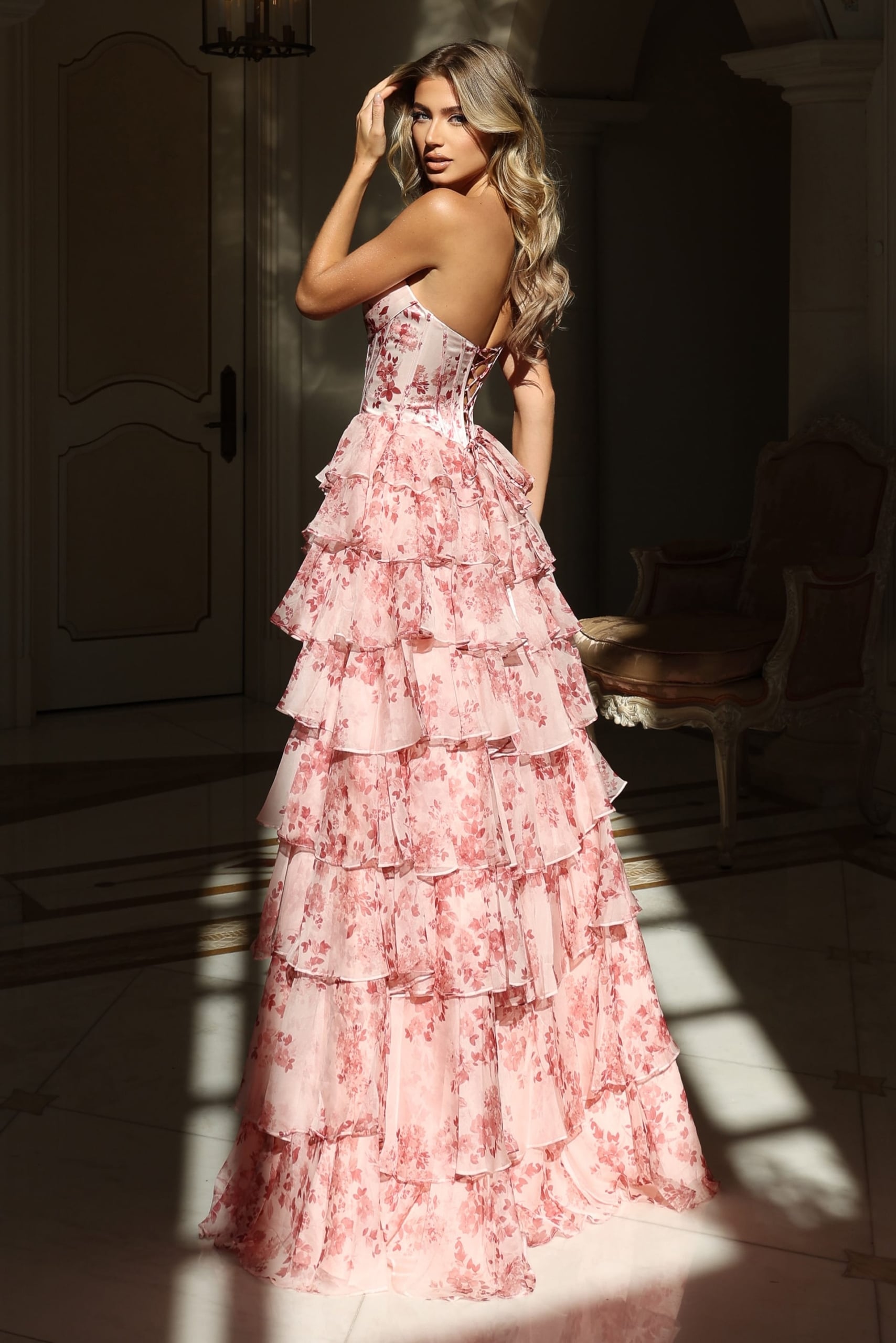 Strapless floral dress featuring layered ruffles and high slit